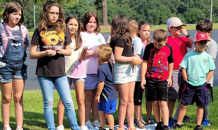 Group of young kids in line outside of church