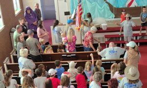 Congregation of people at vacation bible school